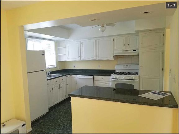 Kitchen with window into backyard