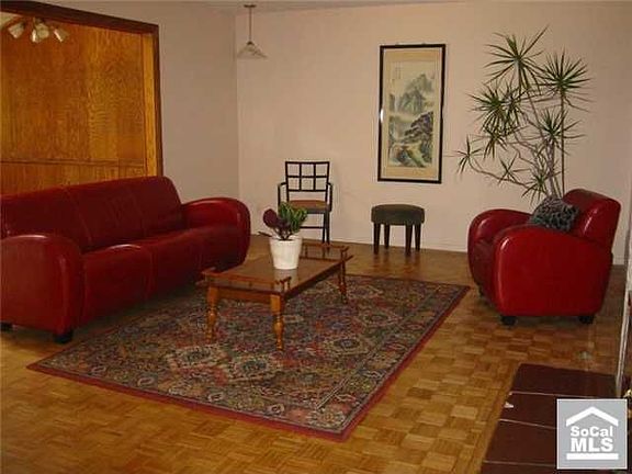 Living room with fireplace and wood floors