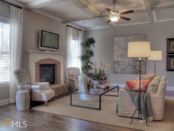 WITH COFFERED CEILING AND FIREPLACE MAKES THIS FAMILY ROOM VERY COZY!