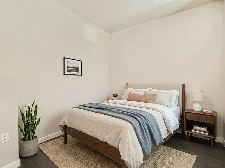 A cozy, sunlit bedroom made for rest.