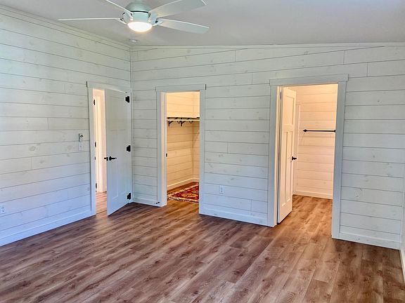 Primary bedroom with walk-in closet and en suite bathroom.