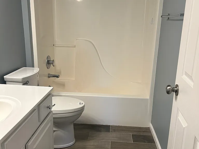 Kids bathroom with tiled floor.