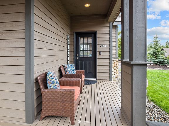 Welcoming front porch is the perfect spot to enjoy your morning coffee.