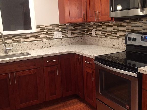 Spacious Kitchen! Plenty of granite counters, and wood cabinets with stainless steel appliances