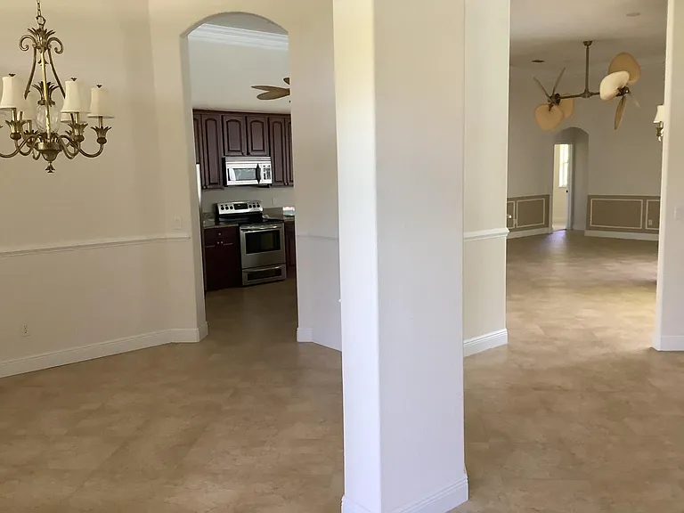 From Foyer over looking the dining room, kitchen and family room