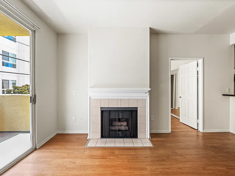 Living Room with Electric Fireplace and Patio