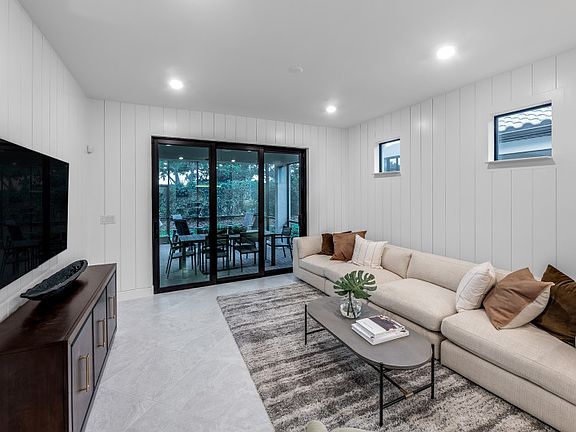 Open Gathering Room with sliding glass door to Lanai