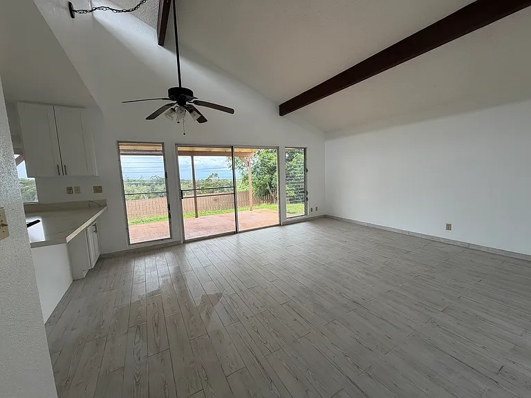 Living room from hallway, panoramic views, large covered lanai.