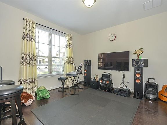Open floor plan with beautiful wide slat wood flooring.