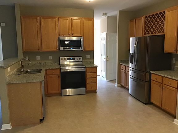 Eat in kitchen with stainless steel appliances