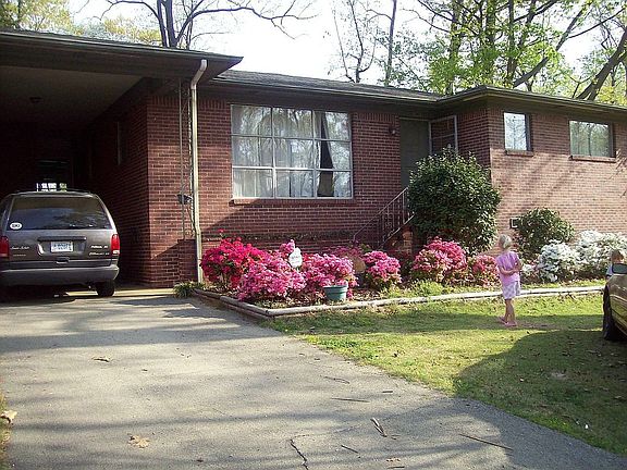 Front of house and yard when all 70 azalea bushes are in bloom