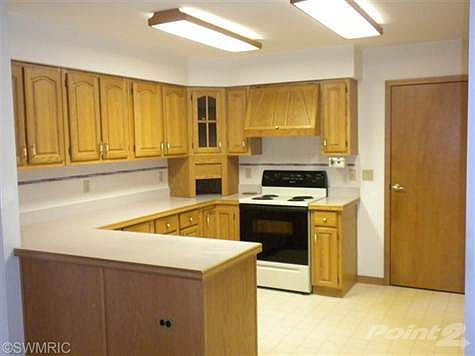 Lots of oak cabinets and counter space.