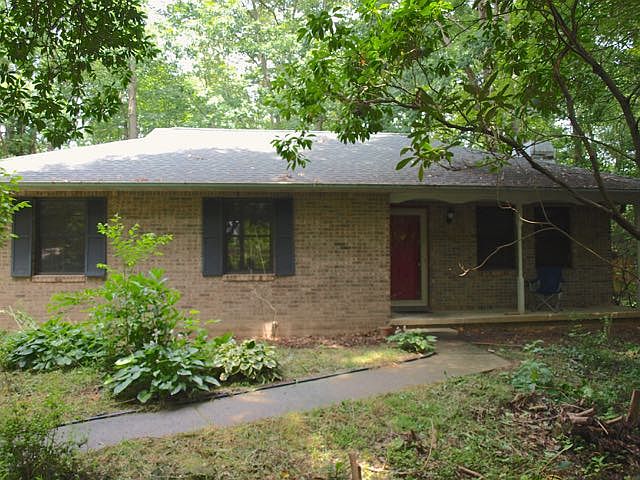 brick home on lush half acre