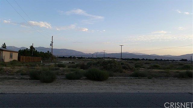 This is the front view from Avenue R. The lot goes all the way back to the Church in the back ground