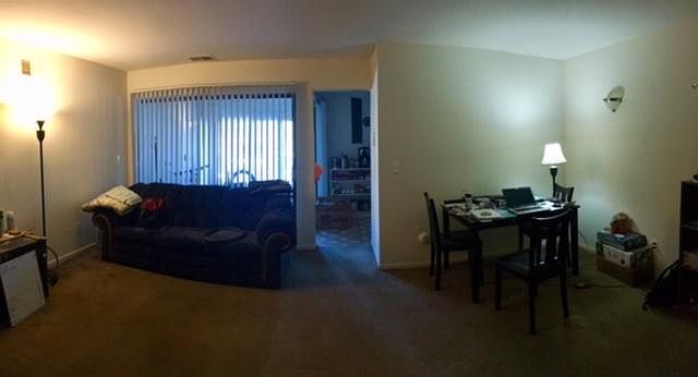 dining/main living space facing sun room, kitchen