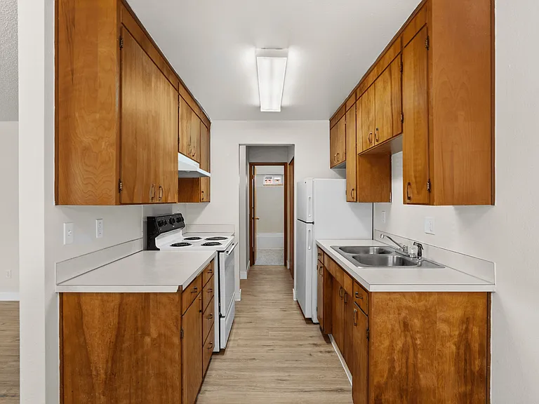 Bright dining space adjacent to the kitchen in a one-bedroom deluxe apartment at Palisades Apartments in Tacoma. Bright dining space adjacent to the kitchen in a one-bedroom deluxe apartment at Palisades Apartments in Tacoma.