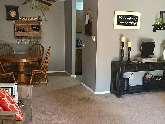 Living room from sliding glass door showing dining area