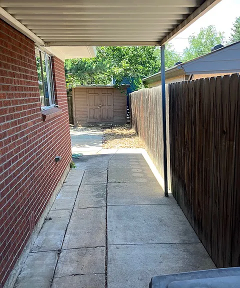 covered walk way to back yard