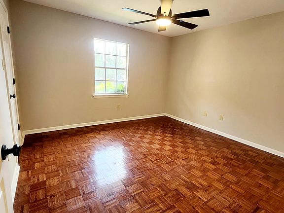 Bedroom with wood floors