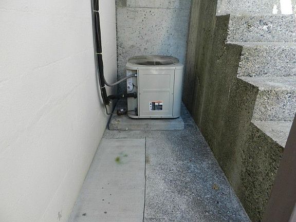 Living room with hardwoods under carpet.