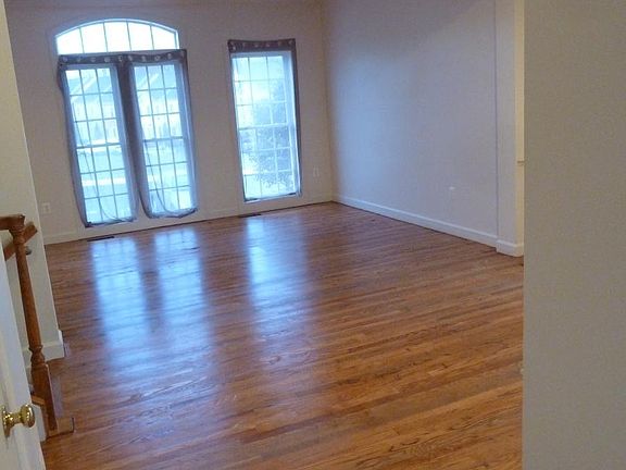 Bright living room overlooking park