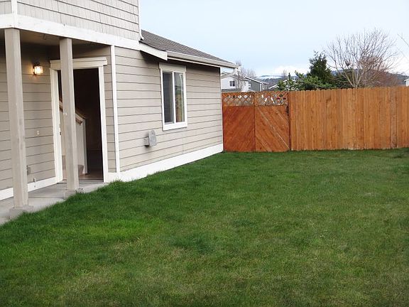 Big front, partial fenced front yard