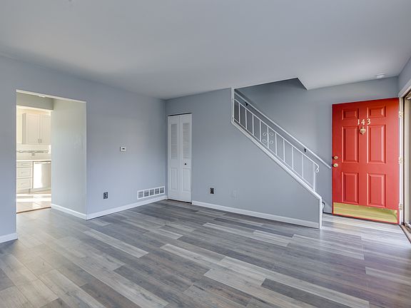 Another view of living room, front door open
