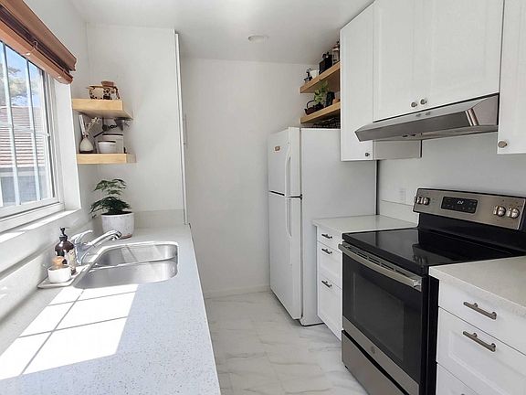 NEW KITCHEN CABINETS with pull out drawers and soft closing doors, floating shelves, induction cooktop