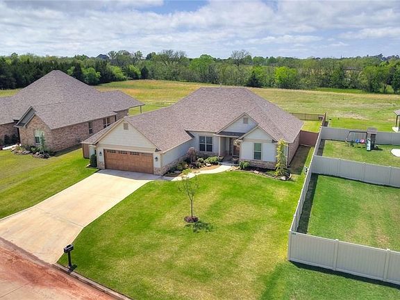 Look at this lot!  Bordering a green belt, with sprinkler heads in front, back and beyond the fence line.  The property extends past the fence line.  An excellent place for a gardener in the abode to play in the dirt.