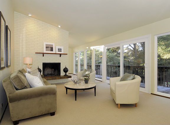 Walls of windows look out to green views