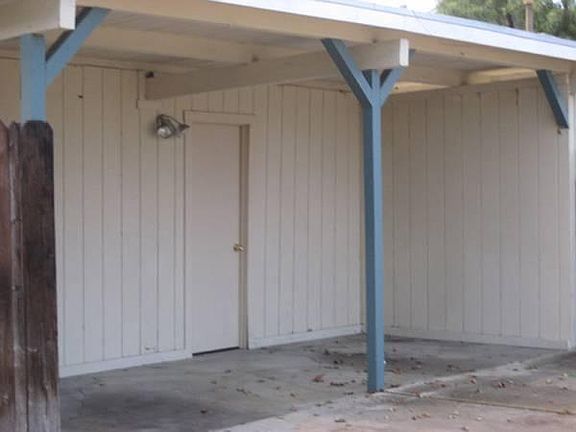 Carport and Door to Storagee