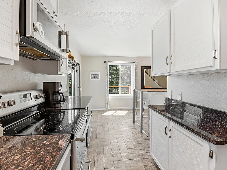 Modern finishes, generous prep space, and stylish details make this kitchen both beautiful and functional for home chefs and entertainers alike
