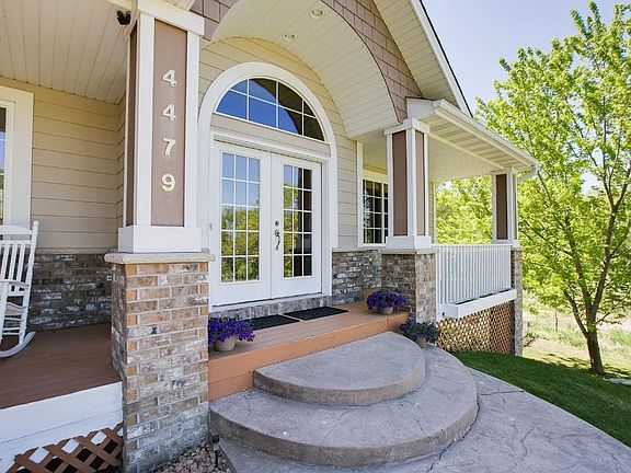 The front porch is spacious and has a great sitting area to enjoy your pond view and wildlife.