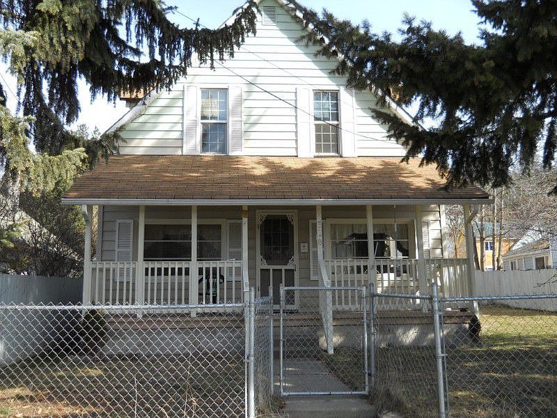 Welcome to this wonderful house! The covered front porch overlooks the quiet neighborhood street wit