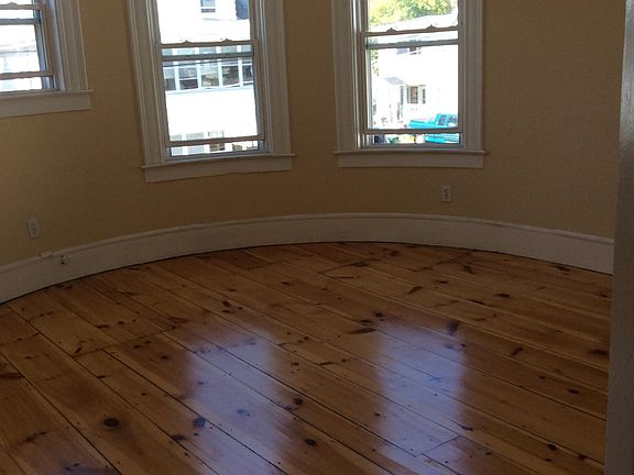 Spacious living room, refinished hardwood floors throughout.