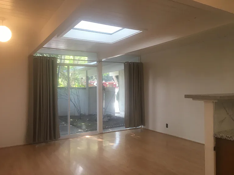 Family room/dining room with large skylight