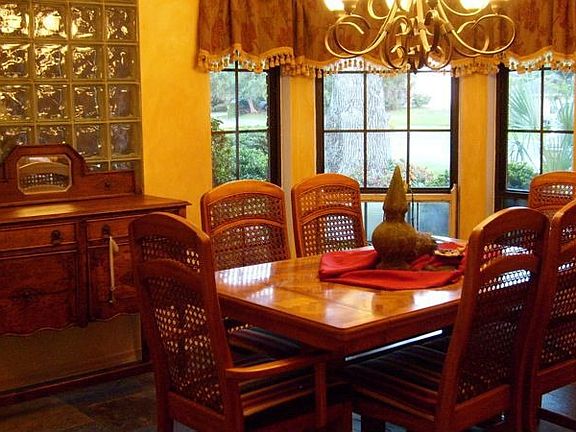 Dining room features slate floors and bay windows
