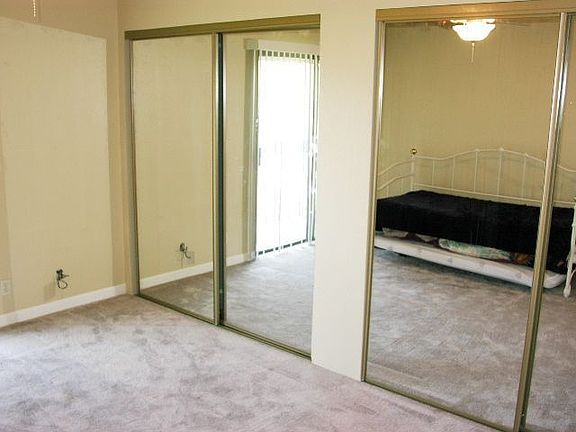 Master suite has balcony overlooking pool.