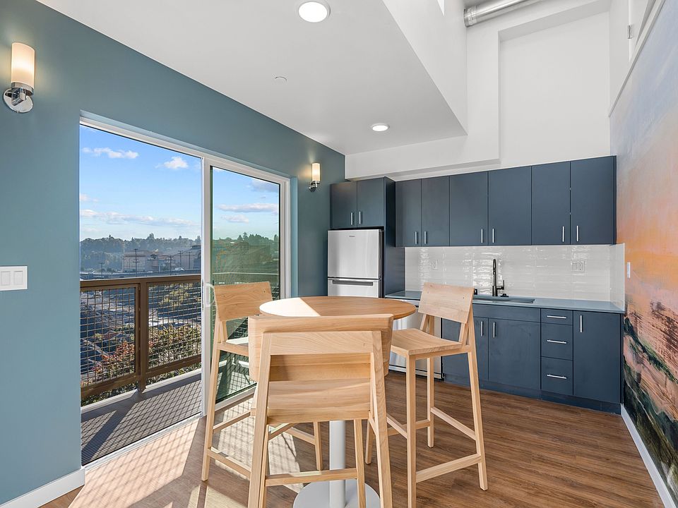 Dine in style in this elegant dining room, featuring a spacious table, comfortable chairs, and a beautiful view.