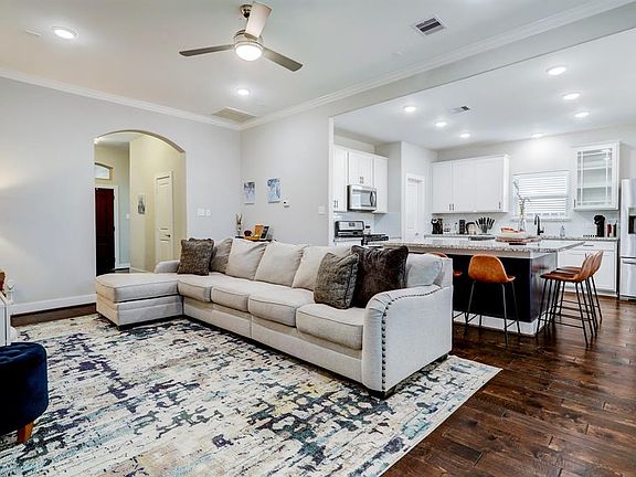 The kitchen opens to the living area for entertaining family and friends