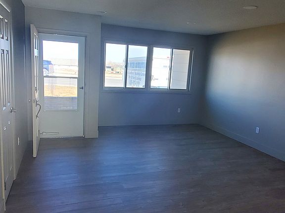 Sun filled, spacious living room with recessed lighting