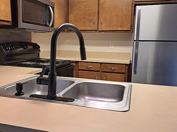 View of Kitchen from Living Room,
New kitchen sink faucet