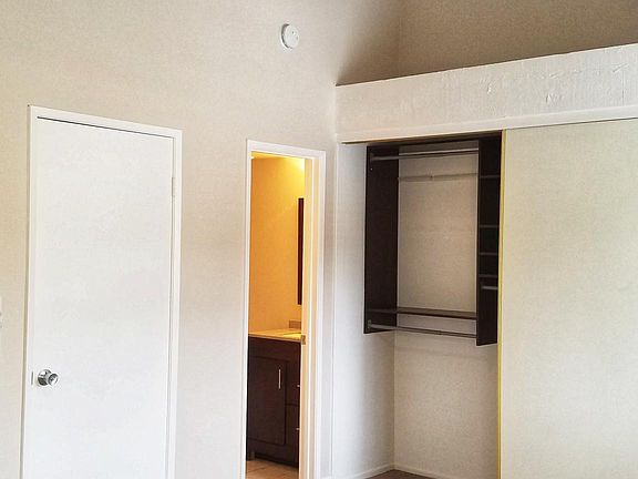 Bedroom 1 w/ attached bathroom Tub/shower combo, new ceiling fan Room size 17' x 11 3/4' Large closet with built-ins 11' 9" length