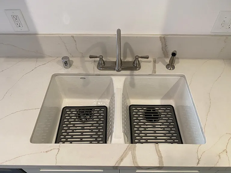 UNDERMOUNT SINK WITH SINK PROTECTORS AND DESIGNER PLUMBING HARDWARE