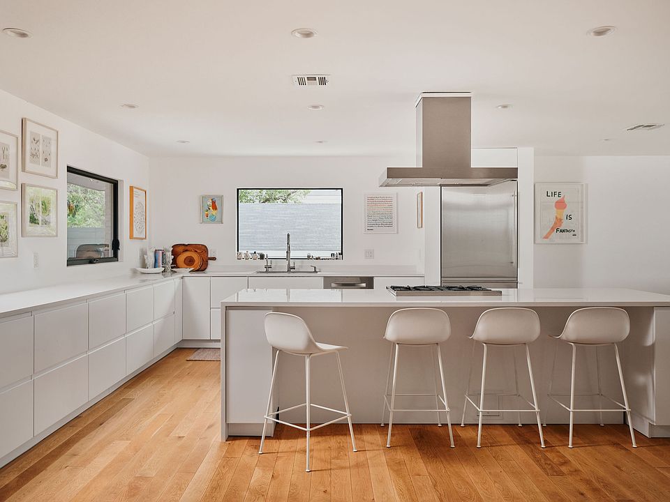 Open kitchen concept with high end appliances including BlueStar range and Liebherr refrigerator.