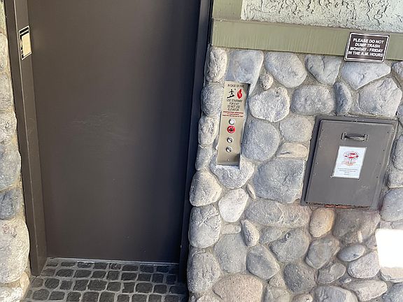 Elevator and Trash next to Unit 122