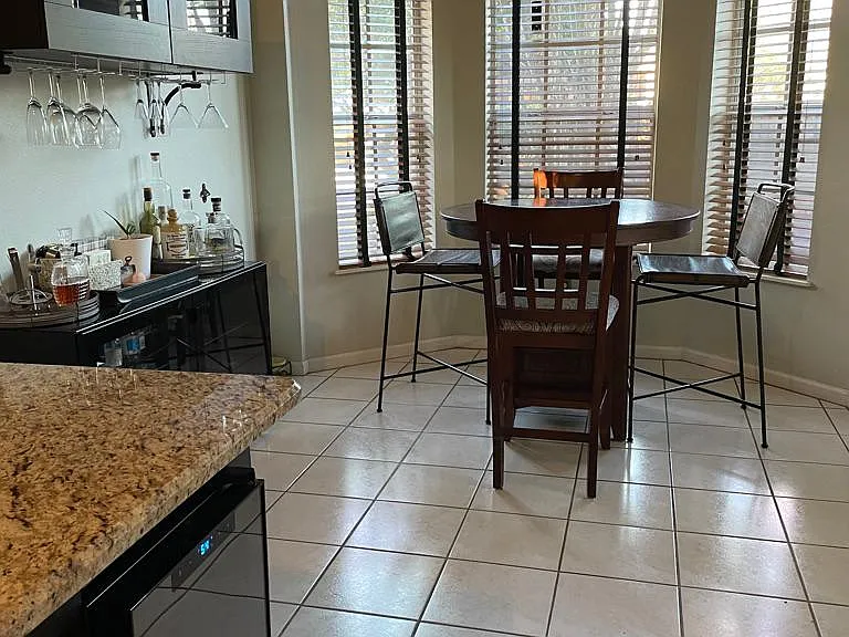 Breakfast nook and bar area with wine fridge
