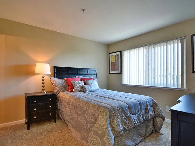 Private master bedroom with large windows at Crooked Oak at Loma Verde Preserve, CA, 94949
