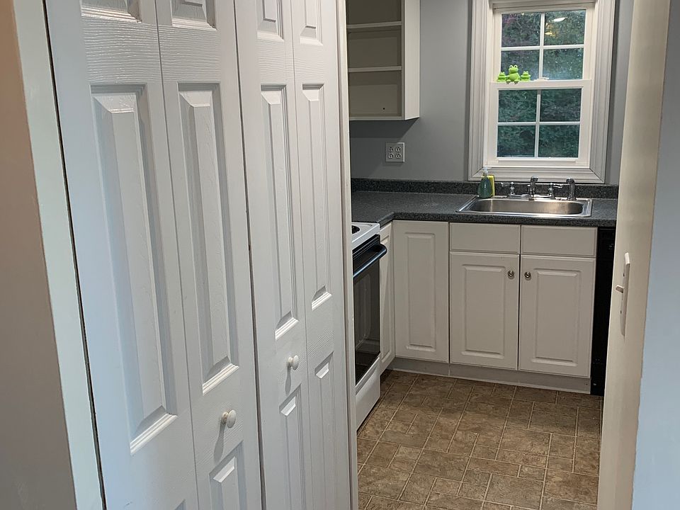 Closet doors at left conceal washer-dryer and broom closet.