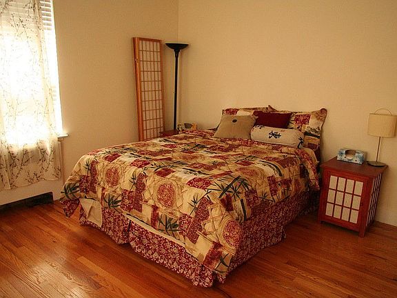 MBdrm. Sunny. 2 lg windows. Wall of build-in vanity, ceil. to flr. closets.